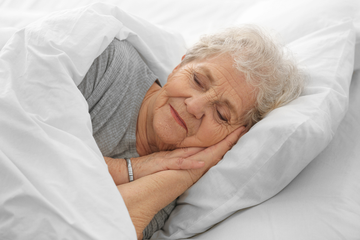 Elderly Woman Sleeping in Bed